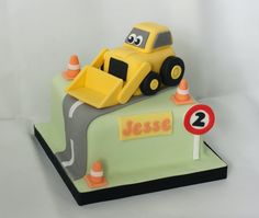 a birthday cake with a construction vehicle on top