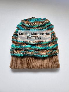 the knitting machine hat pattern is knitted in brown, blue and green yarns