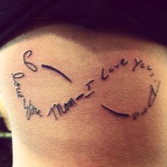 a woman's lower back tattoo with the words i love you in cursive writing