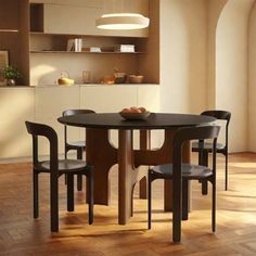 a dining table with four chairs around it