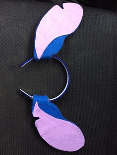 two pieces of paper with blue and pink designs on them