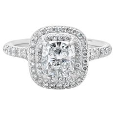 a cushion cut diamond ring set in white gold