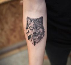 a wolf tattoo on the left arm