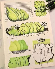 a book with some drawings on it and markers next to it that include green objects