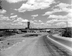 a black and white photo of an empty road