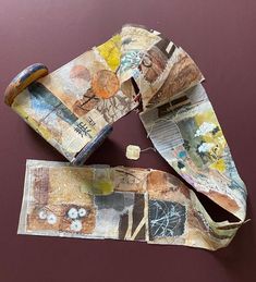 an altered piece of paper with torn pieces on it