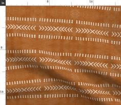 a brown and white blanket with an arrow pattern on the front, and a line drawn across it