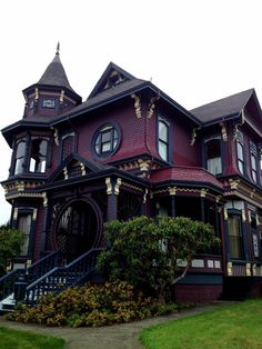 an old victorian style house with many windows