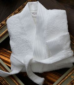 If you're looking for Peacock Alley's softest bathrobe, you've come to the right place. Our Bamboo Bathrobe, in our opinion, is the perfect robe to slip into after a warm shower or bath. 60% Rayon from bamboo / 40% Cotton Constructed with a terry loop for hanging and a corded dobby border detail. Imported from Portugal Dimensions Small/Medium Front chest width: 27"Sleeve length: 20"Length from shoulder: 44" Large/Extra Large Front chest width: 29"Sleeve length: 22"Length from shoulder: 48" Care Cozy White Robe For Relaxation, White Long Sleeve Bathrobe, White Long Sleeve Bath Robe, Peacock Alley, Large White, Color Mixing, Men Sweater, Cotton Blend, Sleeve Length