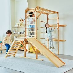 two children playing on a wooden play set