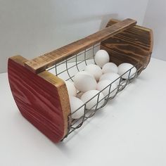 a basket filled with white eggs sitting on top of a table