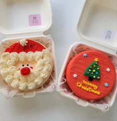 two plastic containers filled with cake decorated like santa clause