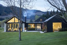 a black house is lit up at night