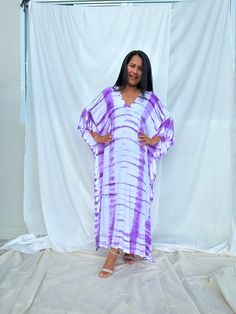 Dive into a world of vibrant color and unique patterns with our tie dye kaftan. Each piece is a masterpiece of individual hand tie-dyeing, ensuring that no two are alike. Crafted with meticulous care and attention, these kaftans offer a burst of style and creativity. Whether you're lounging at home, heading to the beach, or stepping out for an evening on the town, our tie dye kaftan is the perfect choice to make a bold and unforgettable fashion statement. Embrace the artistry and individuality o Spring Batik Print V-neck Kaftan, Casual Purple Tunic Kaftan, Long Sleeve Batik Print Kaftan For Summer, Bohemian Tie Dye Spring Kaftan, Summer Long Sleeve Batik Print Kaftan, Casual Tie Dye Kaftan For Spring, Casual Tie-dye Kaftan For Spring, Spring Casual Tie-dye Kaftan, Spring Vacation Tie-dye Kaftan