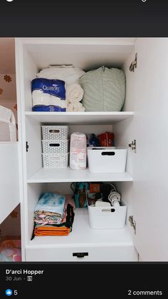 an open closet with baskets and other items