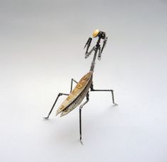 a small toy insect is standing on its legs