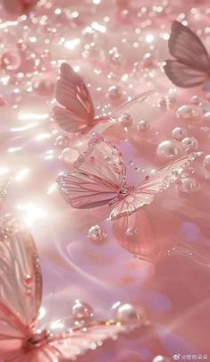 some pink butterflies are flying in the air with water droplets on them and bubbles all around