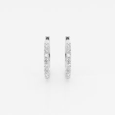 Who doesn't like a pair of classic hoop earrings? This extremely versatile pair can be worn with jeans and a tee, a cocktail dress or at your summer soiree. The high quality lab-grown diamonds shimmer as you move. Classic Small Hoop Diamond Earrings For Everyday Luxury, Classic Hoop Diamond Earrings For Everyday, Classic White Hoop Earrings With Halo Design, Classic White Hoop Earrings For Anniversary, Classic White Huggie Earrings, Classic Small Hoop Earrings With Channel Set, Pearl And Diamond Earrings, Summer Soiree, Pearl Diamond