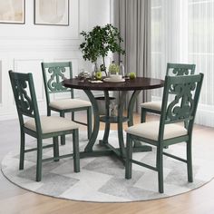 a round table with four chairs around it