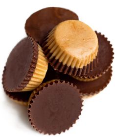 chocolates with peanut butter in them on a white surface