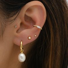 These pearl charm hoops are a show-stopper! Super versatile - the charm is removable so you can also enjoy them as a simple hoop! - - - D E T A I L S - - - * Made of 925 Sterling Silver * THICK plating of 14k Gold or Rhodium * Sold as a PAIR * Nickel-free & Hypoallergenic MEASUREMENTS ‣ Hoop diameter: 10mm ‣ Drop Length: 12mm ‣ Total Length: 27mm Earrings on Model: Pearl Studs: https://www.etsy.com/listing/1130010634/pearl-stud-earrings-pearl-studs-dainty?click_key=83267f2c3719acdbf298643b426d96 Pearl Earring Stack, Pearl And Gold Earrings, Earring Stack, Minimalist Studs, Dainty Studs, Tiny Studs, Small Earrings Studs, Pearl Hoop Earrings, Earrings Pearl