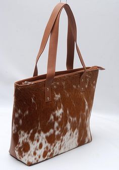 Splendid Lady Hand Bag of Natural Cowhides Absolutely one-of-a-kind, is one of those bags you don't ever want to leave home without. Handcrafted from very finest cowhide, Bag is sumptuous and unique, hand-selected hide and beautiful patterning. And with an abundance of space, it can take whatever you choose to throw at it - your laptop, an extra pair of flats, that stack of post you've been meaning to send. With this stunning cowhide bag on your arm (or slung over your shoulder - you're ready fo Cowhide Bag, Ladies Bag, Bag Shoulder, Hand Bag, Calgary, Leather Bag, Accessory Gift, Bag Lady, Laptop