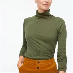 Nwt J Crew Tissue Turtleneck Tee In Olive Green Heathered Small Light Weight, Long Sleeves With Straight Hem. Fitted Soft And Comfortable. Fabric & Care 70% Cotton, 30% Polyester Machine Washable Approximate Measurements Lying Flat Pit To Pit- About 17" Length From Shoulder Seam To Bottom-26" Green Turtleneck Top For Fall, Fall Green Turtleneck Top, Cotton Turtleneck Tops For Work, Chic Green Turtleneck Top, Green Turtleneck Top For Layering, Small Light, Fabric Care, Olive Green, J Crew