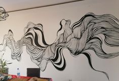 the wall is painted with black and white lines