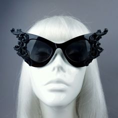 Hand-decorated black filigree ornate sunglasses. Decorated with hand moulded filigree & roses. These can be made in red or white if you ask. Please note: There is no readymade sunglasses box large enough for these sunglasses. These sunglasses are wearable art and need to be treated with due care. While i have taken every possible care to make them sturdy throwing them in a bag careless may damage them. Treat them as you would a precious thing... Hand-decorated black filigree ornate sunglasse Black Steampunk Sunglasses With Tinted Lenses, Vintage Black Sunglasses For Parties, Gothic Black Sunglasses For Party, Black Gothic Sunglasses For Party, Vintage Black Sunglasses For Festival, Vampire Goth Fashion, Sunglasses Decorated, Gothic Couture, Dark Beauty Magazine