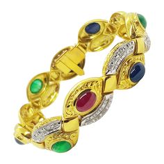 Cabochon Ruby 5.82 carats, Cabochon Emerald 3.58 carats, Cabochon Blue Sapphire 9.05 carats with Diamond 0.94 carat Bracelet set in 18 Karat Gold Settings Width: 1.6 cm Length: 19.8 cm Total Weight: 48.17 grams "We first opened doors in 1980 when it was then situated in the vicinity of the Victory Monument; a small and modest storefront with a couple of counters. From its humble beginnings to where it stands today, our company has proven its abilities as a jeweler. Since the beginning, we have b Cabochon Ruby, Emerald Blue, Bracelet Tennis, Antique Bracelets, Bangles Jewelry Designs, Ruby Emerald, Blue Sapphire Diamond, Bangles Jewelry, Vintage Bracelets