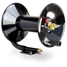 an image of a black speaker with wires attached to the front end and side view mirror