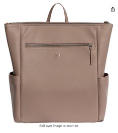 a large beige bag with zippers on the side