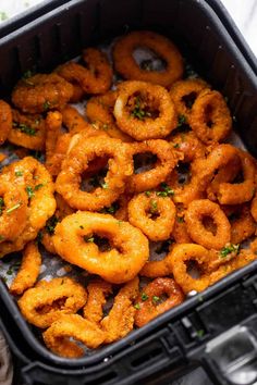 a container filled with onion rings on top of a table