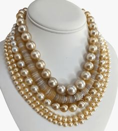 Indulge in the elegance and natural beauty of this stunning South Sea pearls necklace, featuring Golden South Sea pearls sourced from Indonesia. Crafted with meticulous attention to detail, this necklace is a testament to exceptional craftsmanship and exquisite materials. Secured with a 14K yellow gold 'twist and lock' clasp, the necklace measures 17.25 inches (43.5cm) in length, draping gracefully around the neckline. The weight of 95.7g adds a substantial feel and underscores the luxurious qua Luxury Pearl Round Beads Jewelry, Luxury Antique Pearl Necklace With Pearl Chain, Luxury Multi-strand Pearl Necklaces, Graduated Pearl Necklace The Pearl Source, Luxury Gold Pearl Necklace With Faceted Beads, Luxury Yellow Pearl Jewelry, Luxury Yellow Gold Diamond Pearl Necklace, Luxury Gold Plated Yellow Gold Pearl Necklace, Gaudy Jewelry