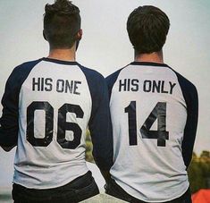 two men wearing matching shirts that say his one has only 004 and the other is not