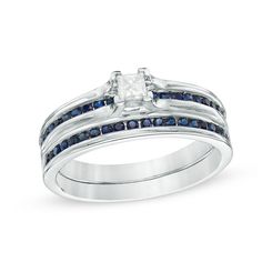 a white gold ring with blue sapphire stones