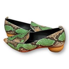 A Classic Loafer Marries Shape And Texture In Unexpected Ways With Its Reptilian-Embossed Upper, Pointy Toe And Spherical Wood Heel. 1 1/4" Heel Appear Unworn , Maybe Tried On. Green Heels With Leather Sole And Flat Heel, Green Flat Heels With Leather Sole, Green Slip-on Closed Toe Loafers, Slip-on Pointed Toe Flats For Galas, Green Pointed Toe Casual Loafers, Green Slip-on Flats With Leather Sole, Green Pointed Toe Loafers For Spring, Green Pointed Toe Flats For Fall, Spring Green Pointed Toe Loafers