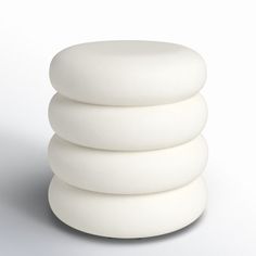 a stack of white round objects sitting on top of each other