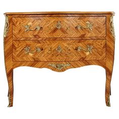 an ornate wooden dresser with drawers