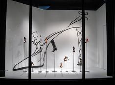 an artistic display in a dark room filled with mannequins