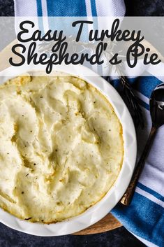 easy turkey shepherd's pie on a white plate with a blue and white towel