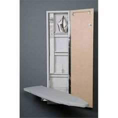 an ironing board is attached to the back of a cabinet with it's door open