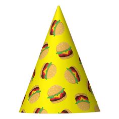 a yellow party hat with hot dogs and buns on it