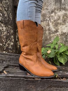 Strut like a rancher when you compliment your favorite looks with these luscious faux leather cowboy boots that sport a satisfying embroidered design for added impact. 1.32" heel 9.6'' shaft 14.5'' circumference Pull-on Water resistant Man-made upper Man-made lining Man-made footbed Man-made midsole Rubber sole Casual Moto Boots For Western-themed Events, Casual Mid-calf Boots With Round Toe For Western-themed Events, Casual Mid-calf Boots With Snip Toe For Ranch, Casual Mid-calf Boots With Round Toe For Western Events, Casual Mid-calf Snip Toe Boots For Ranch, Casual Mid-calf Boots With Round Toe For Ranch, Casual Western-styled Mid-calf Boots, Casual Mid-calf Boots For Fall Ranch, Casual Mid-calf Boots For Western-themed Spring Events