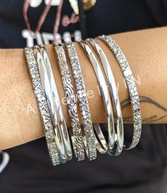 8 PCs. Set of bangles, Flower Textured Bangle, Multi Design bangles, 925 Silver Bangle, Bangles for Woman Simple bangle Valentine's day Gift Handmade item Materials: Silver Adjustable : No Style: Minimalist Bracelet Size Inches Circumference/Diameter 7 / 2.23 7.5 / 2.39 8 / 2.55 8.5 / 2.71 9 / 2.87 9.5 / 3 Elegant, , minimal and shiny ! A lovely basic to have in your wardrobe and wear anytime  O T H E R ∙ I N F O R M A T I O N * All items are nicely packaged ready to gift in elegant jewelry boxes. Please store your jewelry away from humidity, the best place being in a jewelry box  IMPORANT NOTE ON BANGLE SIZES  Please see the photo in the listing that shows how to measure for your bangle size. Your bangle size is determined more by the size of your hand than your wrist. To find out your ba Valentine's Day Sterling Silver Heart Bangle, Bohemian Metal Bangle Nickel-free, Nickel-free Bohemian Sterling Silver Bangle, Valentine's Day Heart-shaped Adjustable Bangle, Spiritual Silver-colored Brass Bangle, Simple Bangle, Flower Texture, The Bangles, Minimalist Bracelet