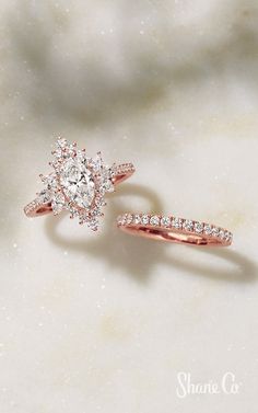 two rose gold rings with diamonds on them