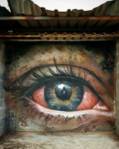 an eye painted on the side of a building