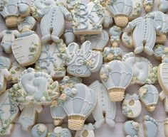 many decorated cookies are displayed on a table