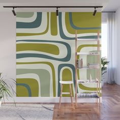 an orange and white wall mural in a living room with wooden flooring, bookshelves