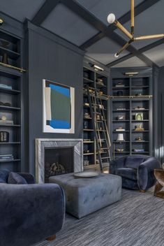 a living room filled with furniture and a fire place in the middle of a room